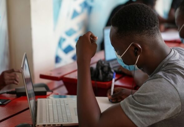 Person using a laptop to build digital skills for employment and small business growth in Ghana