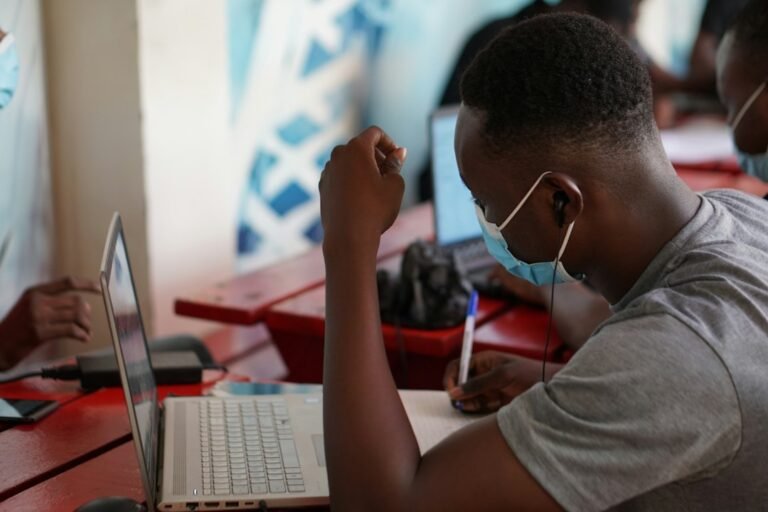 Person using a laptop to build digital skills for employment and small business growth in Ghana