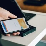 Smartphone and payment card illustrating digital finance