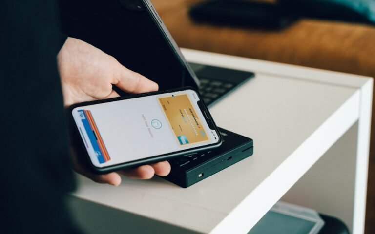 Smartphone and payment card illustrating digital finance