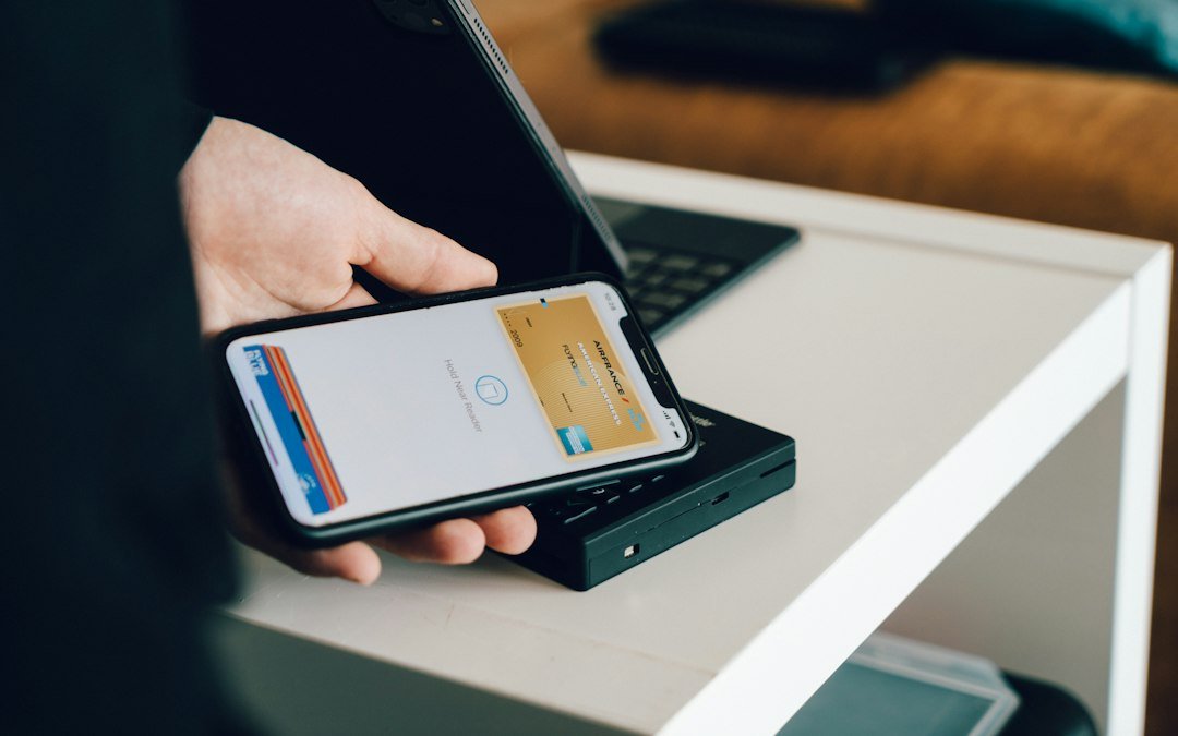 Smartphone and payment card illustrating digital finance