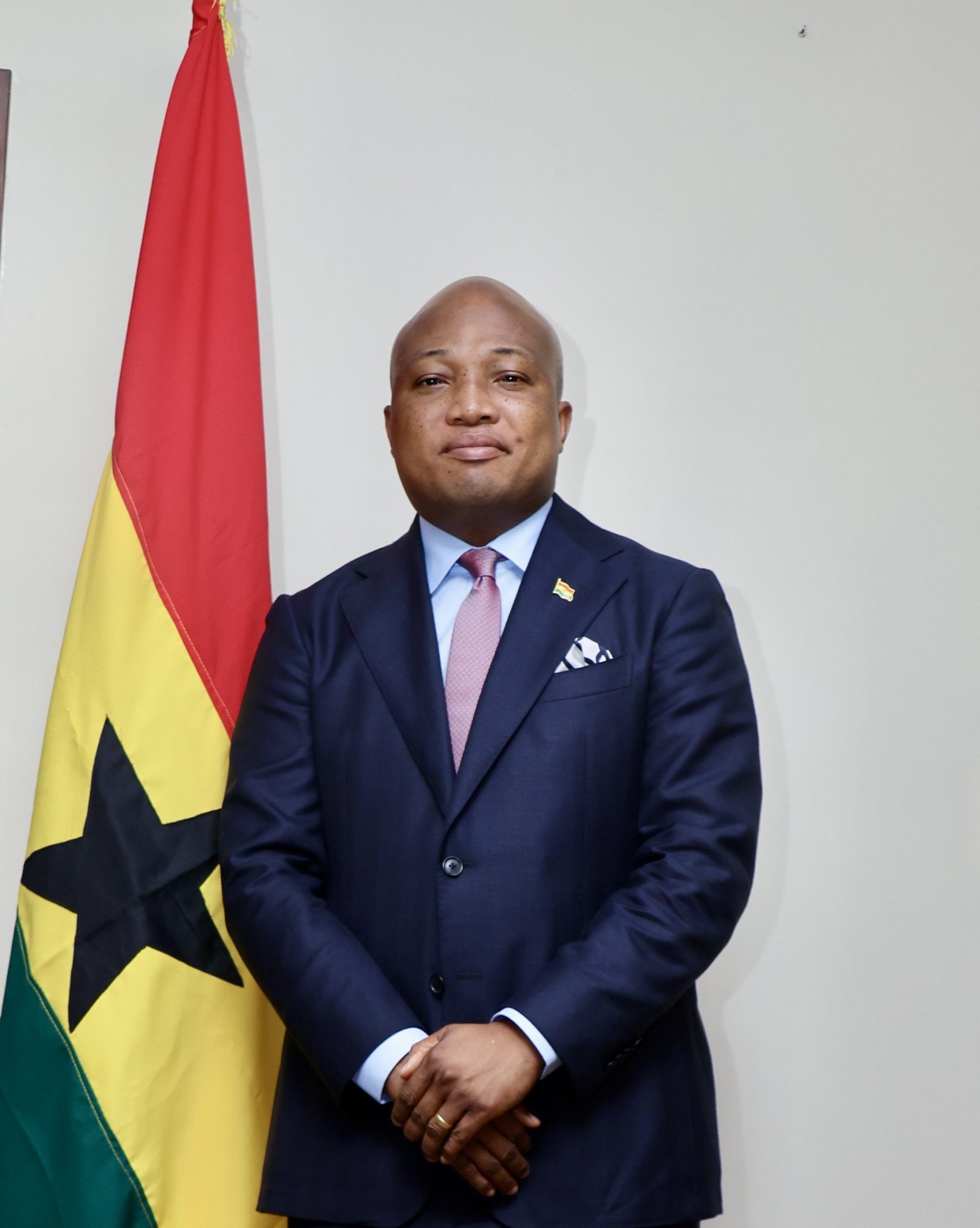 Ghana Foreign Affairs Minister Samuel Okudzeto Ablakwa beside the Ghana flag; official portrait